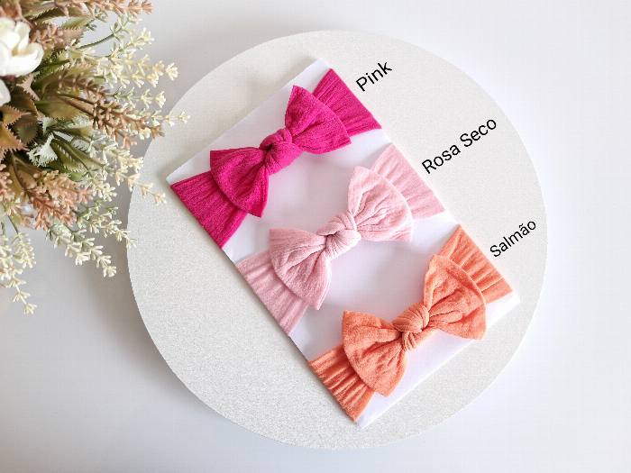 Laços em rosa seco e salmão para meninas